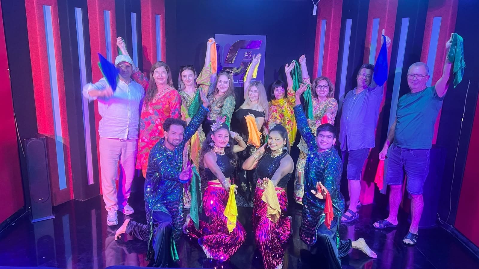 Guests in costume dancing at a Bollywood studio