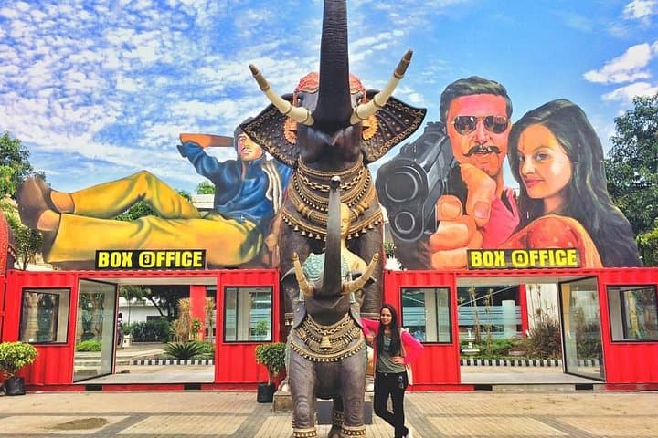 The Box Office gates and painted film hoardings at the studio entrance