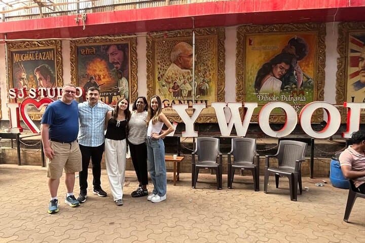 Guests at the I Love Bollywood sign outside the studio