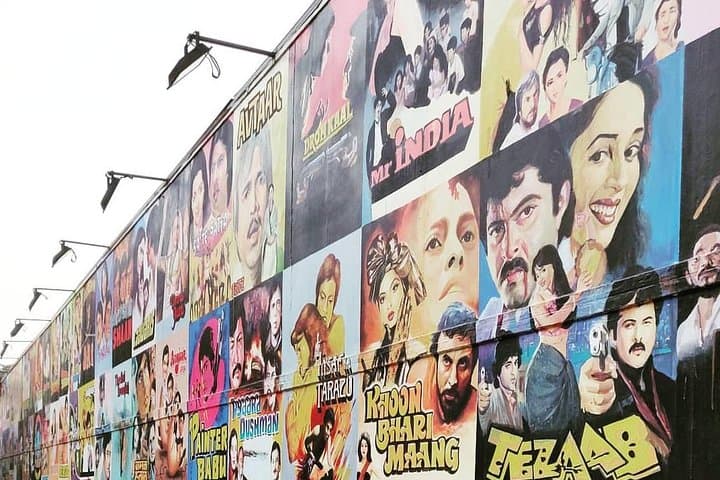 A wall of hand-painted classic Bollywood film posters