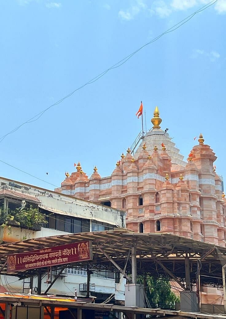 A temple shikhara rising above the street