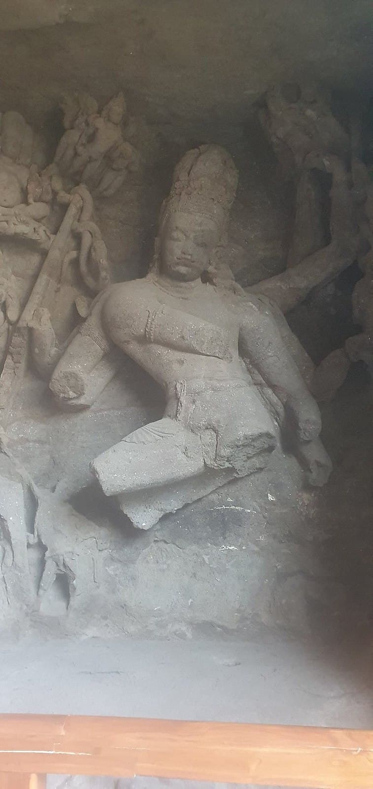 A multi-armed Shiva carved into the cave wall