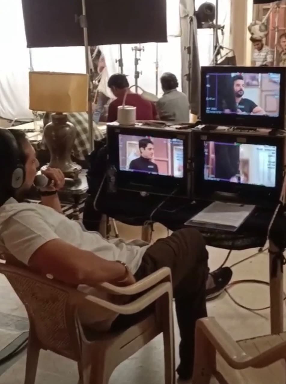 Behind the monitors on a film set