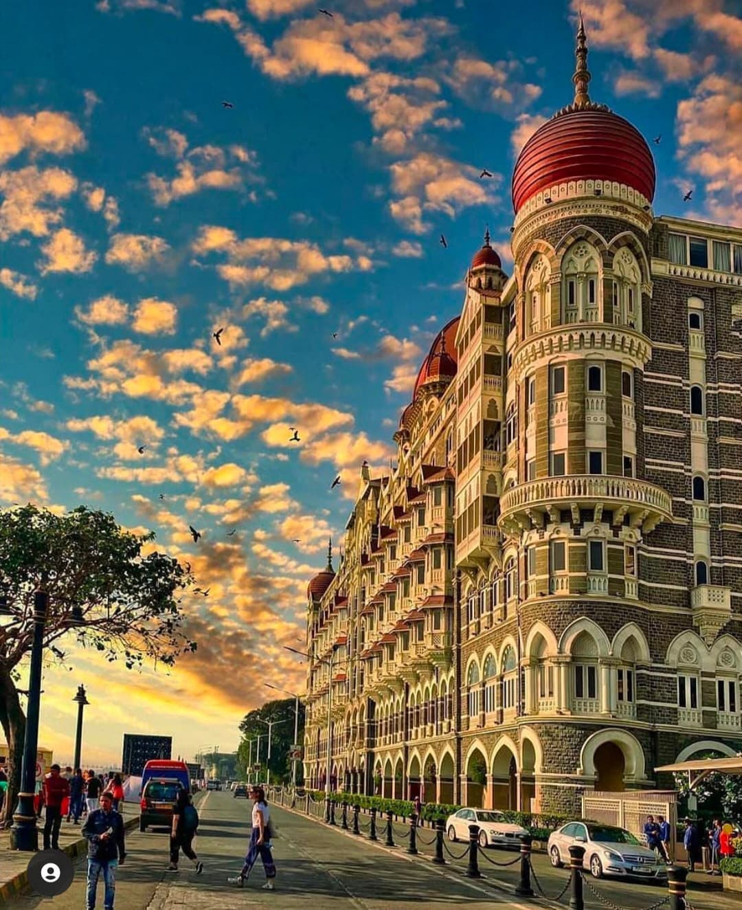 The Taj Mahal Palace Hotel under a dramatic sunset sky