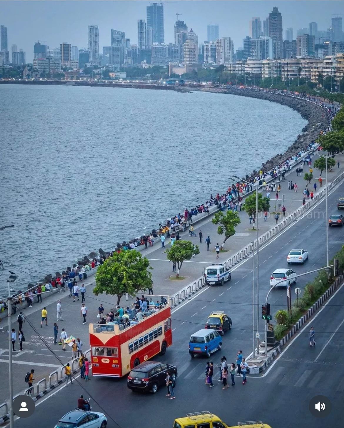 A red double-decker bus on Marine Drive