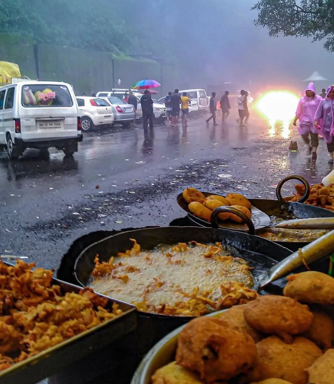 Street food frying in the monsoon rain