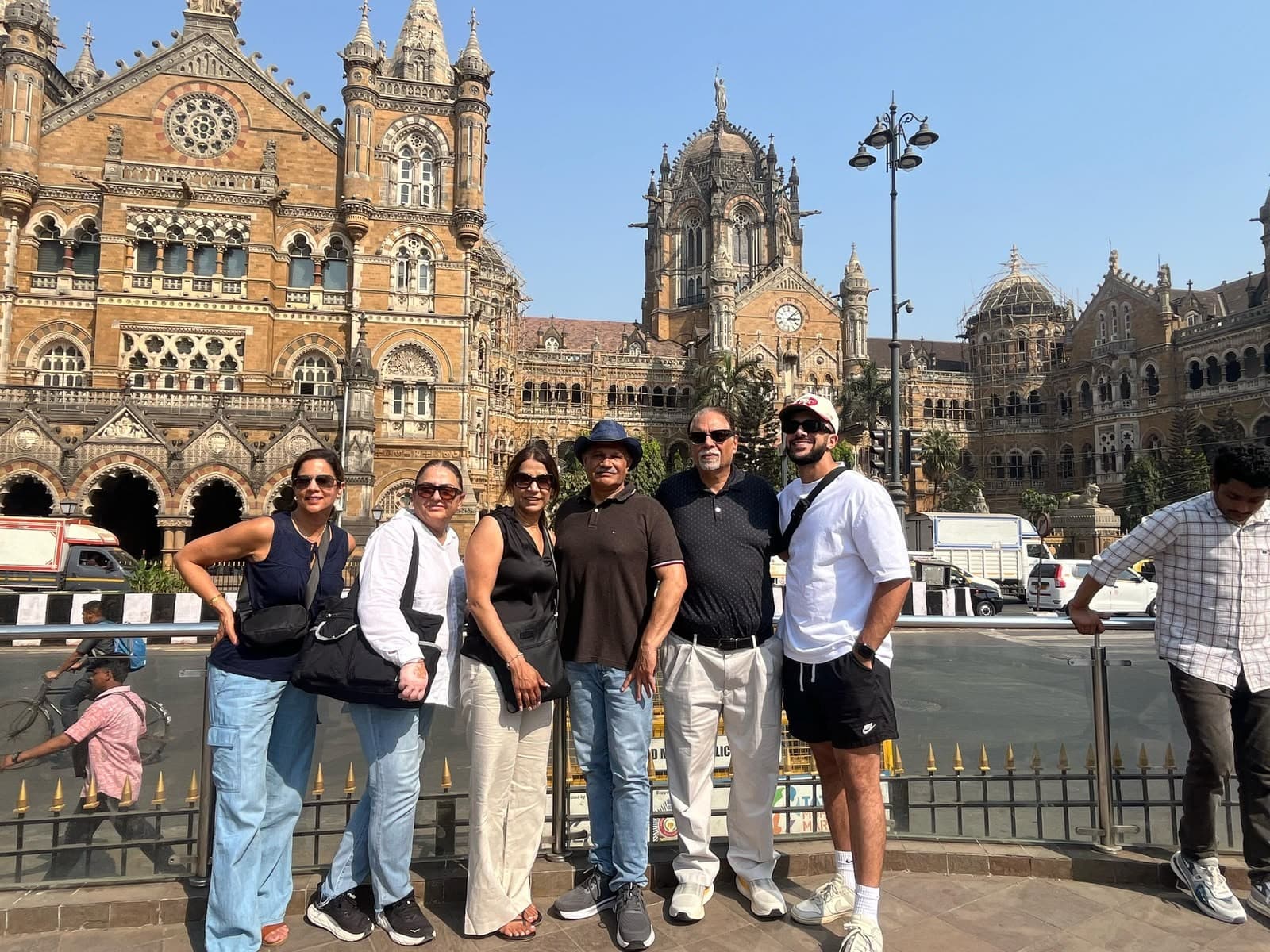 A tour group outside CST