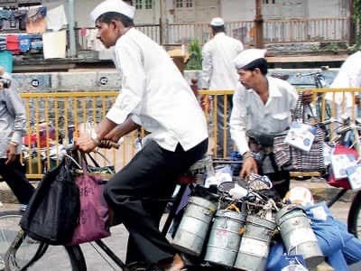A dabbawala loading tiffin boxes