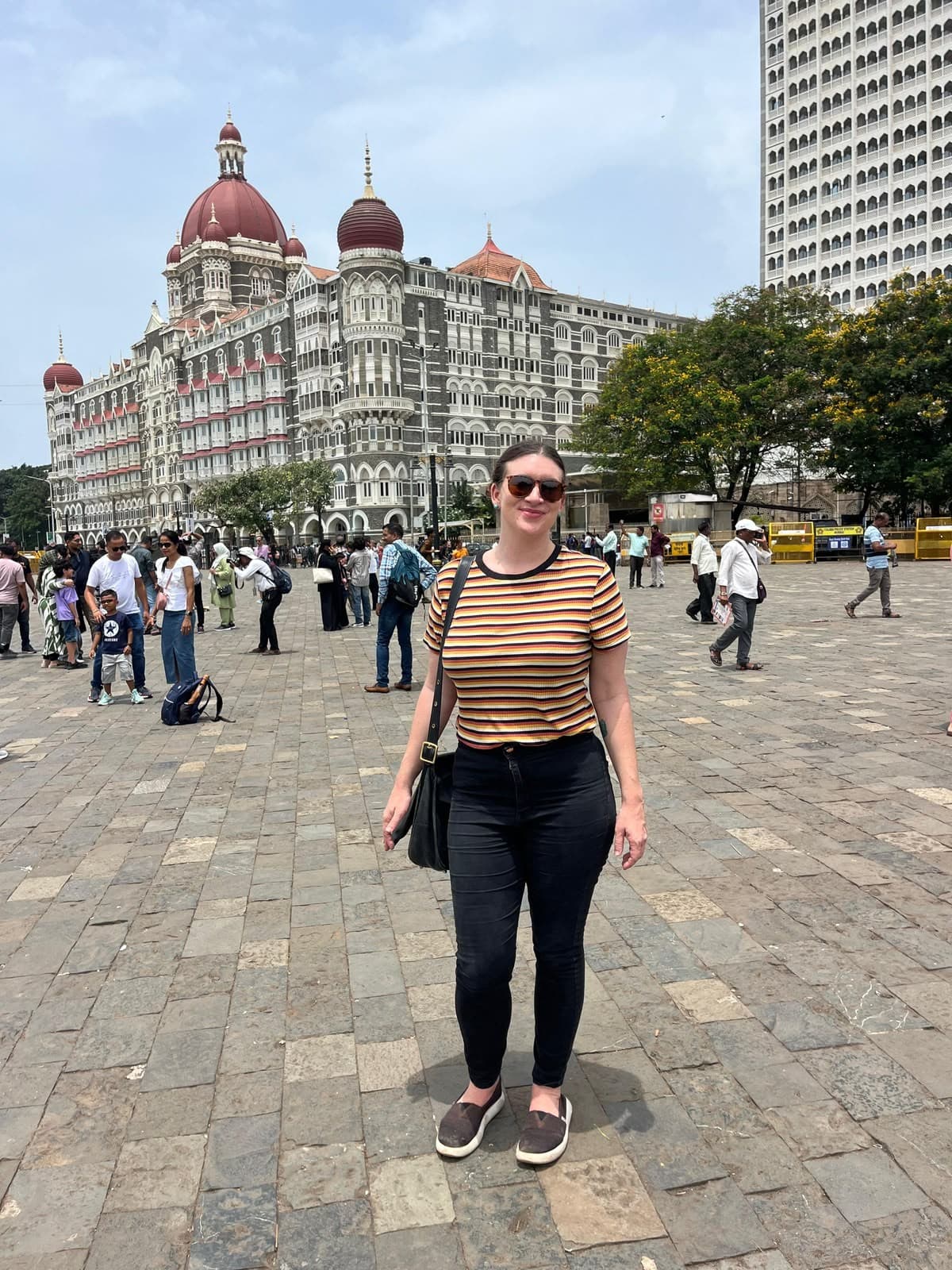 A guest in front of the Taj Mahal Palace Hotel