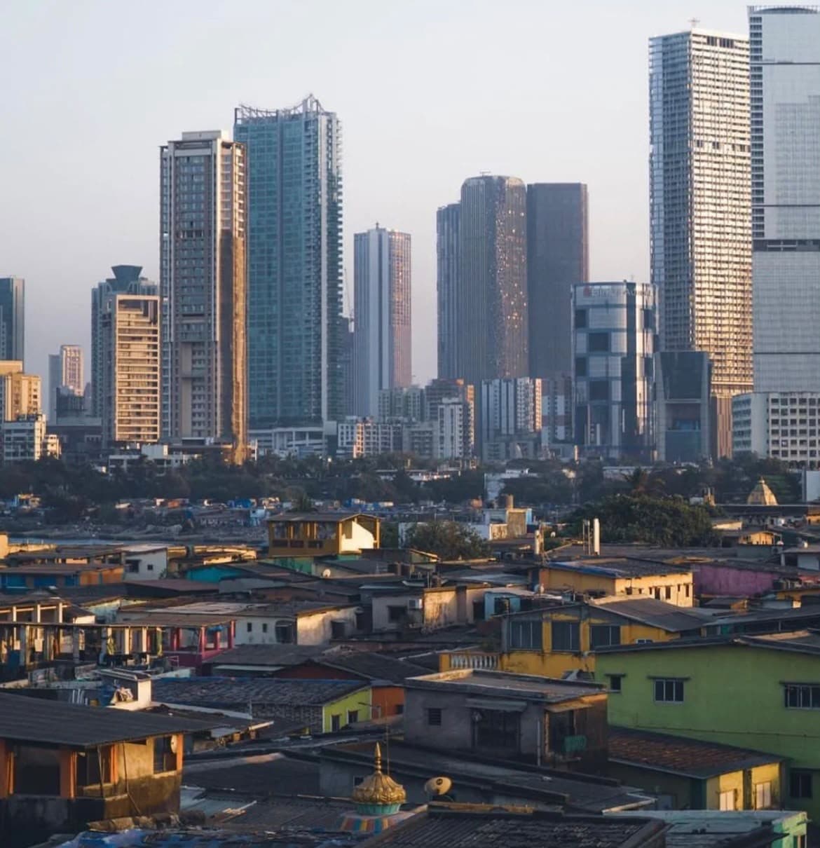 Dharavi rooftops against the Mumbai skyline