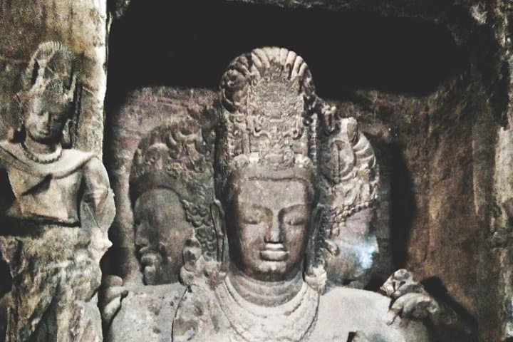The three-headed Trimurti sculpture of Shiva in the main cave at Elephanta