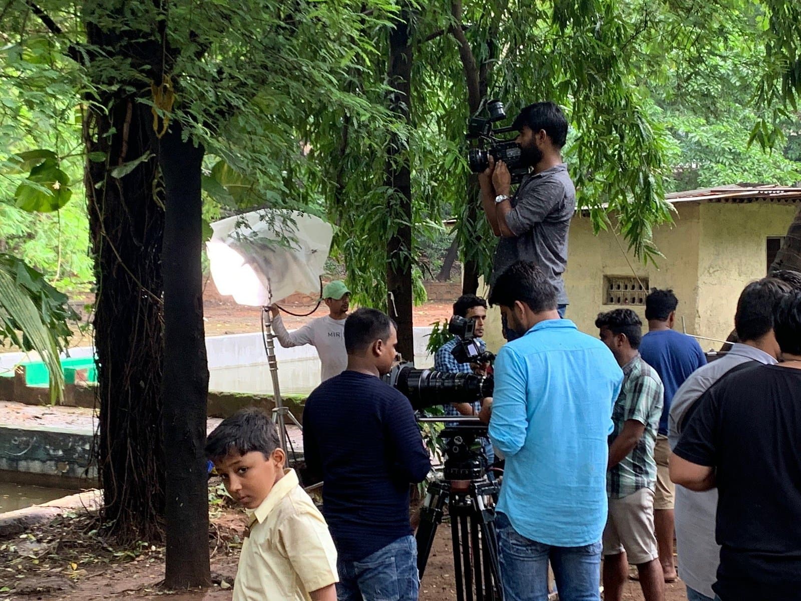A film crew shooting a scene on an outdoor set