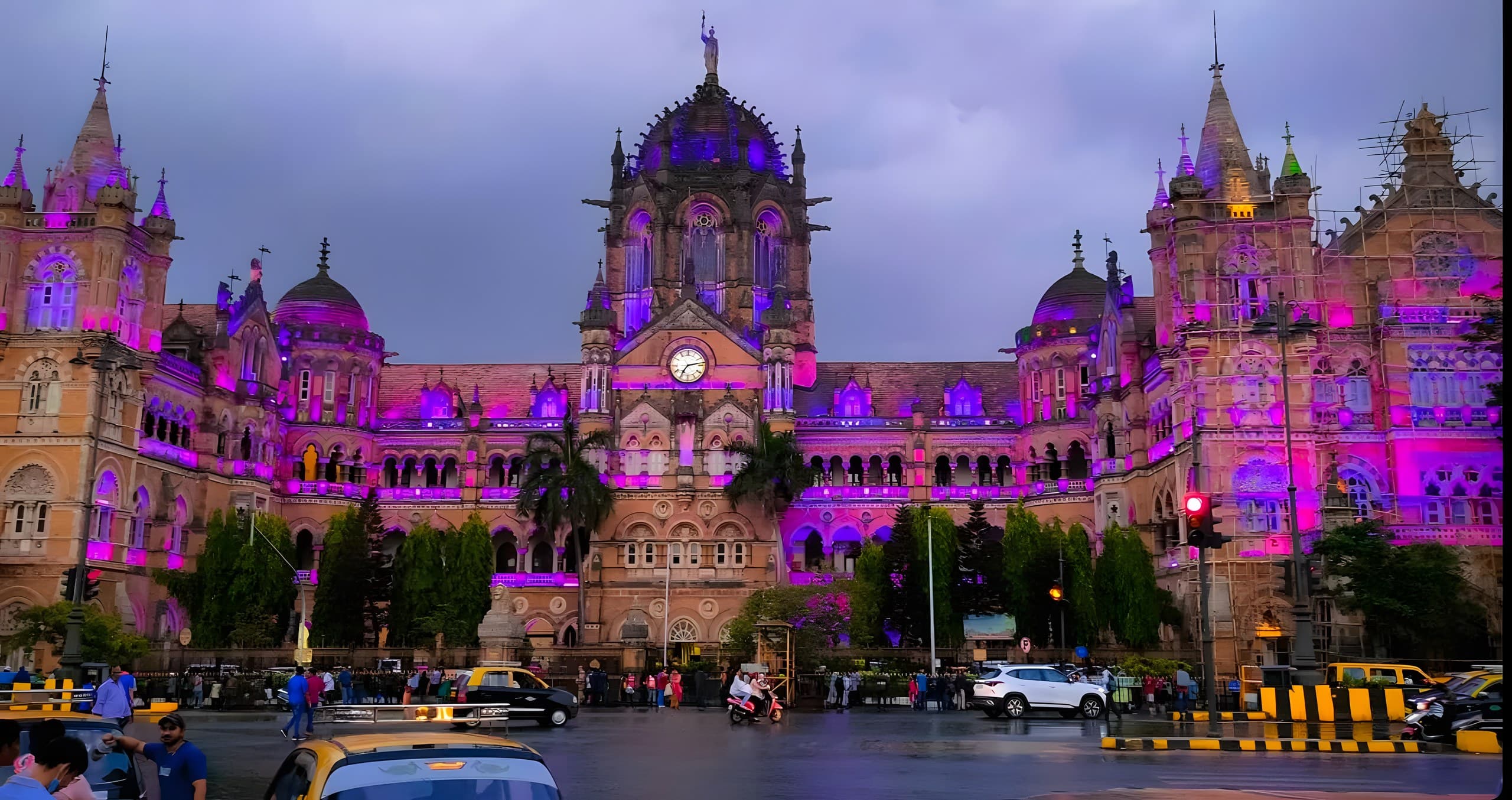 Chhatrapati Shivaji Terminus lit purple at dusk